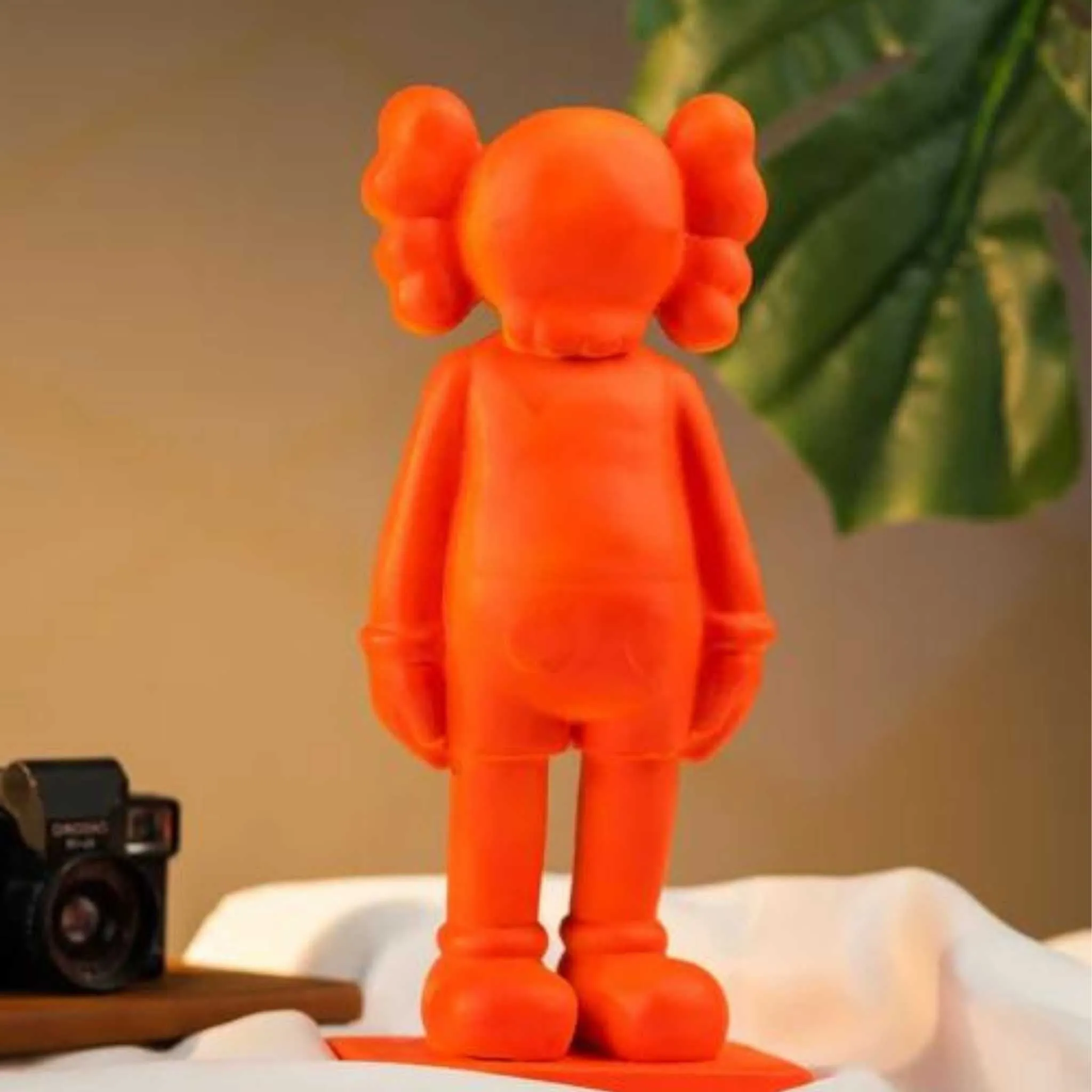 Fiery Orange: The KAWS Figure